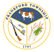 Municipal seal: graphics inside circle include a dark cow, rifle, fishing rod, wheat and a grasshopper